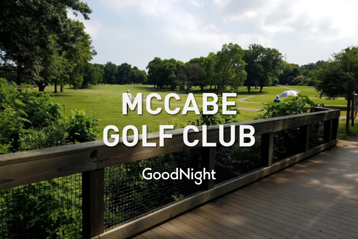 This exterior image showcases a lush golf course with a winding wooden walkway surrounded by greenery. The scene captures the tranquility and open space of the outdoors, with the sun setting in the background, inviting viewers to imagine relaxing social moments in a beautiful, natural environment.