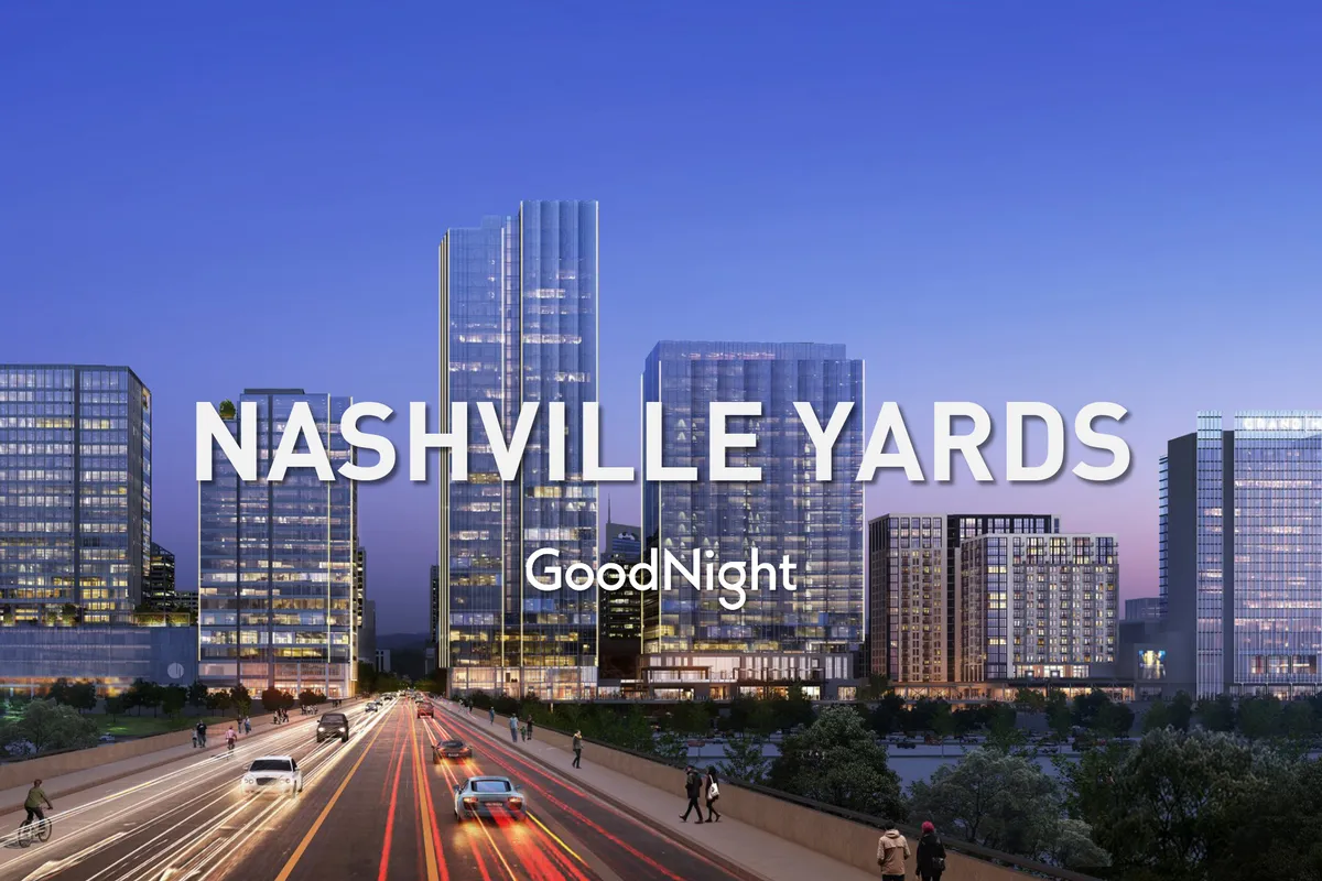 An energetic Nashville cityscape showing skyscrapers, bustling traffic, and urban life at dusk. The lively city lights and skyline reflect downtown’s vibrancy and accessibility.